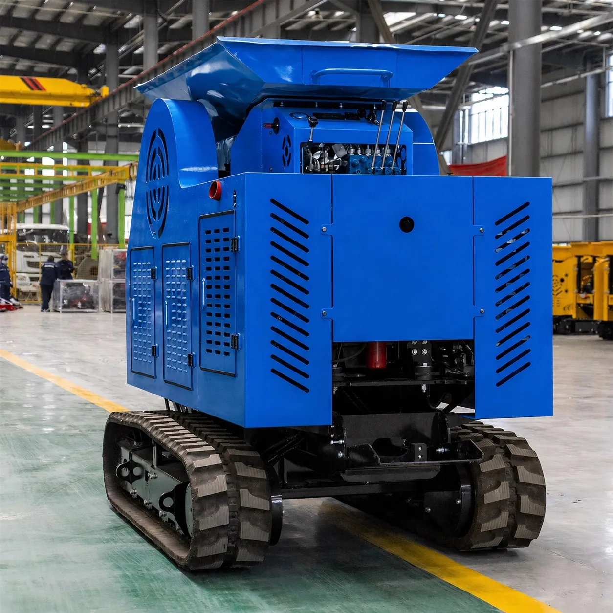 Mobilní drtička Crusher zezadu: servisní dvířka, chlazení a pásový podvozek